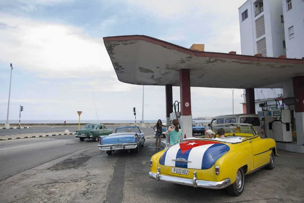 Cubans are known for their love of classic cars. Alexandre Meneghini/Reuters