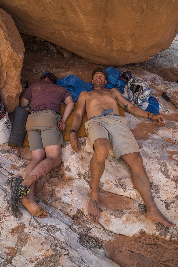 Marble Canyon Kevin Fedarko and Pete McBride rest before hiking out early on their first leg of their sectional hike. McBride suffered hyponatremia, dangerously low salt levels.