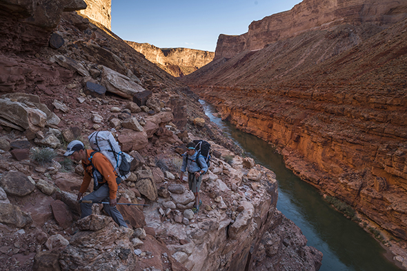 Mike St. Pierre and Kevin Fedarko negotiate the exposure on top of the Red Wall layer which cliffs out some 500-800 feet straight to the river. Marble Canyon.