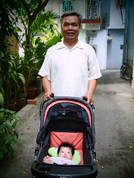 Grandpa walking his granddaughter, District 1