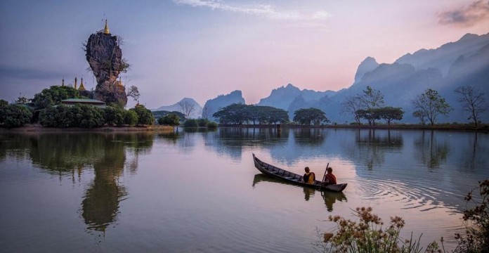 Kyauk Ka Lat Lake in Hpa-An, Kayin State, rowing toward a monastery
