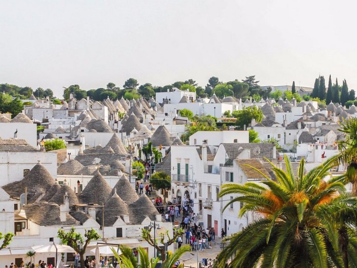 alberobello-located-in-puglia-italy-is-famous-for-its-trulli-or-limestone-dwellings-that-have-been-preserved-as-a-unesco-world-heritage-site-the-popular-tourist-town-has-stunni