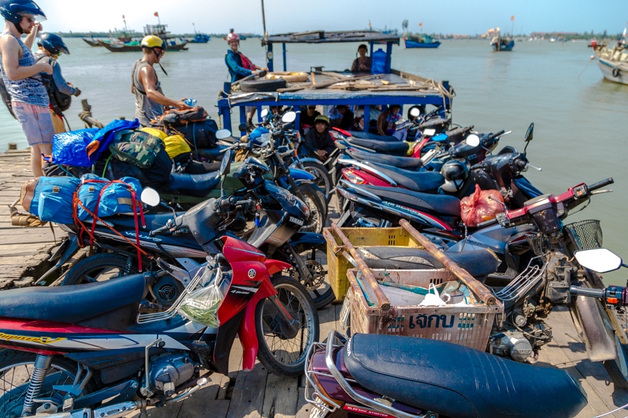 catching a ferry across to hoi an motorbike vietnam