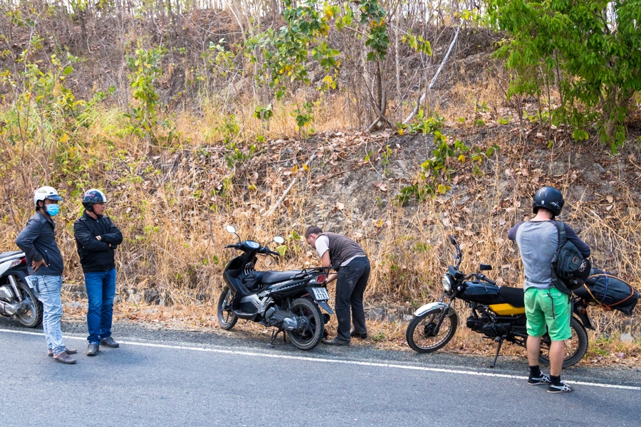 helping some poor guy motorbike vietnam