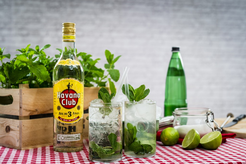 sitting on a beach with a mojito