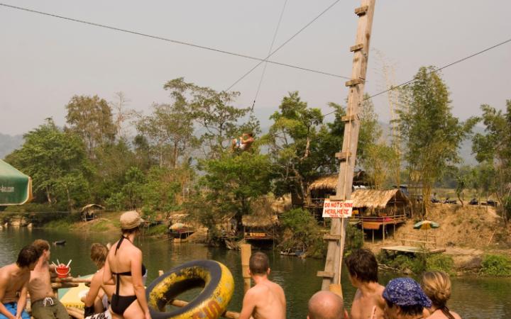 Tourists gather at the tubing hotspot of Vang Vieng, Laos CREDIT: ALAMY
