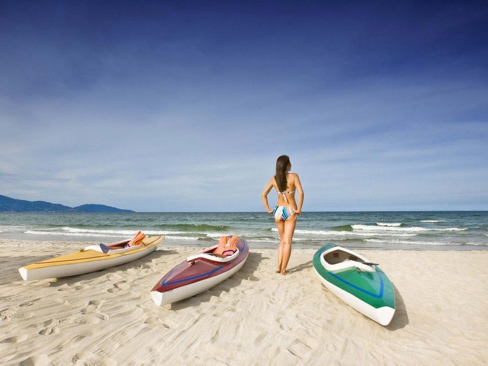Framed by mountains to the north and south, Da Nang beach sits on a gently