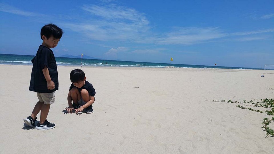 Non Nuoc Beach featuring boating and a sandy beach