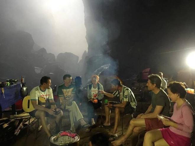 travelers and porters together in son doong cave