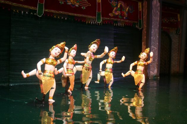 watching water puppet show vietnam travel