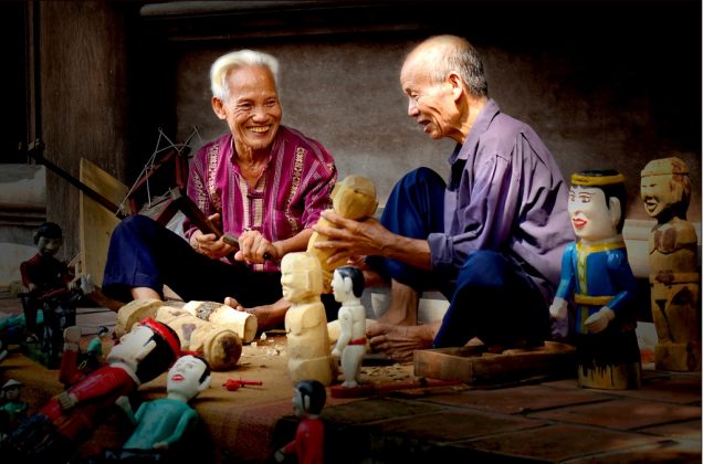 watching water puppet show vietnam travel