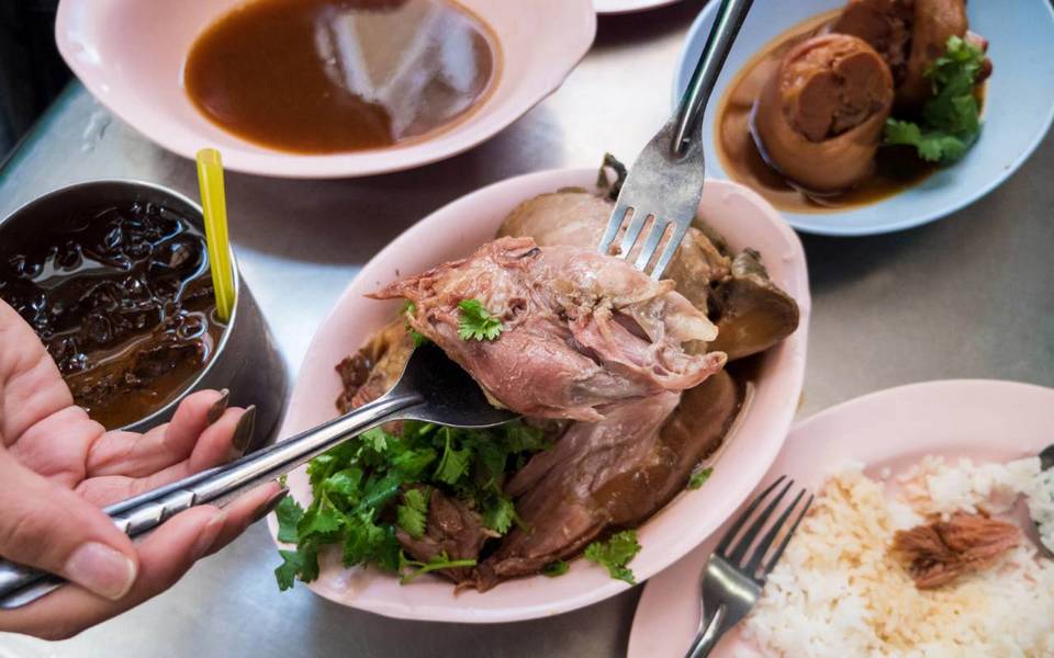 Enjoy Khao Kha Moo (stewed pork rice)
