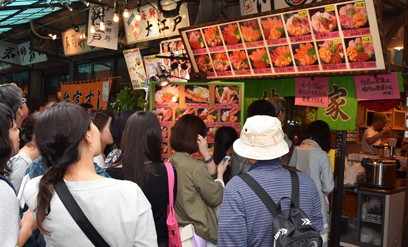 customers line up wait to order food in tokyo
