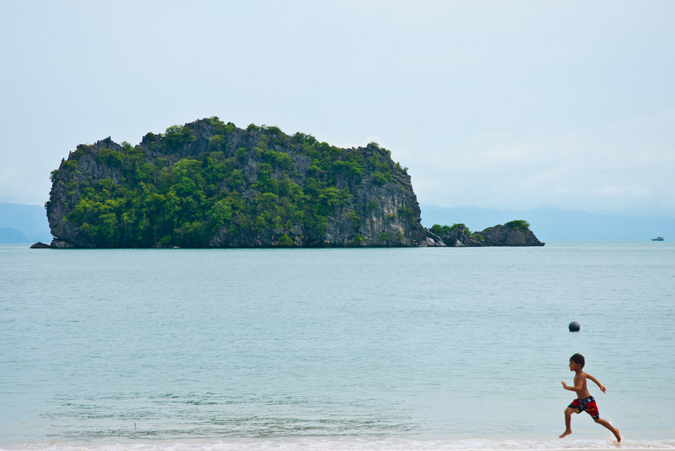 Boy running on Tanjung Rhu