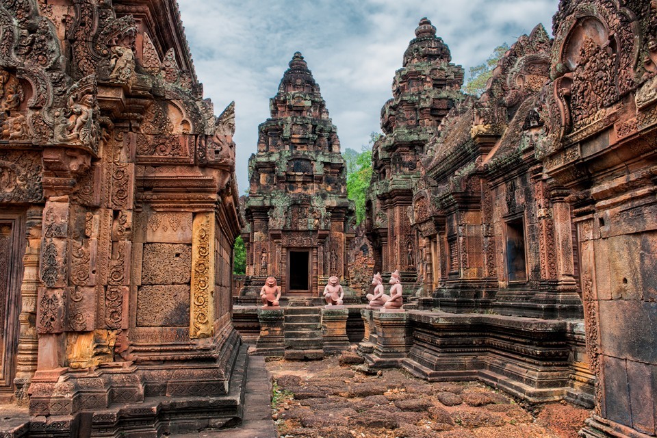 Banteay Srei is built largely of a hard red sandstone that can be carved like wood.