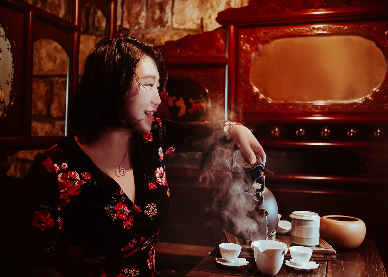 Pouring a cup of steaming hot tea in the Jiufen Teahouse.