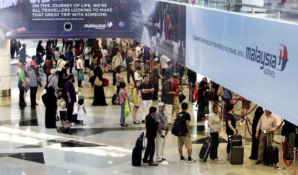 Passengers queue for customs checks at KLIA