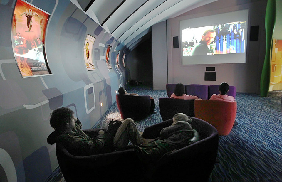 Passengers watch a movie at Terminal 2