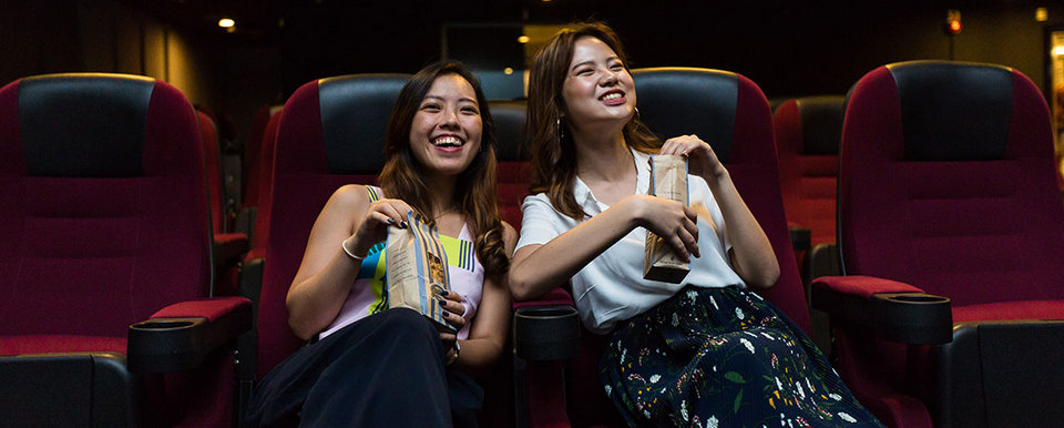 Passengers watch a movie at Terminal 2.