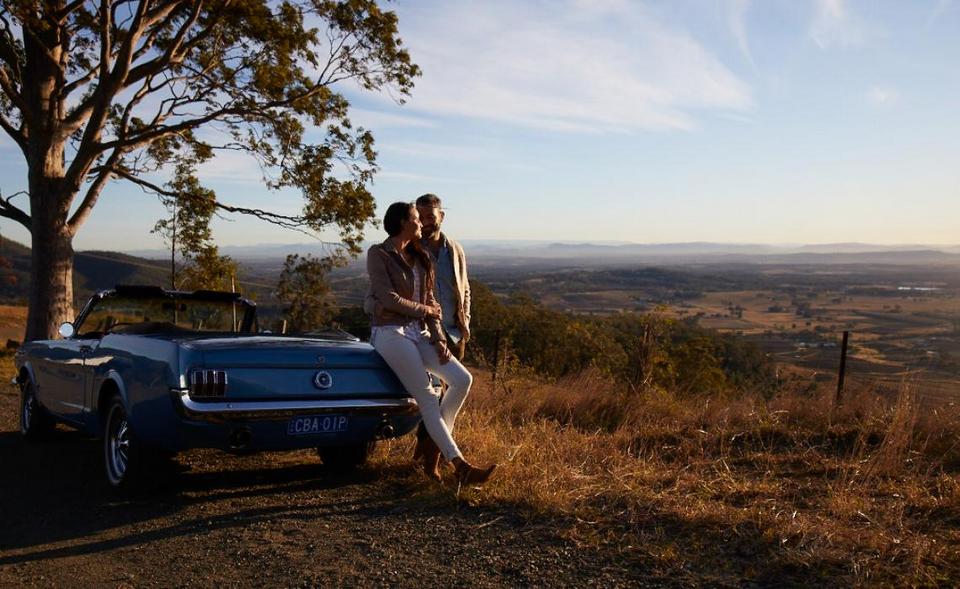 Couple pulled over to watch the sunrise in Pokolbin, Hunter Valley