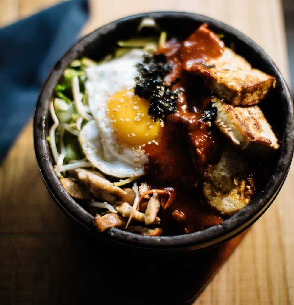 https://cdn.livingnomads.com/2019/03/01/bibimbap-korean-must-try-food-must-eat-in-korea-must-eat-korean-food-must-try-food-in-korea-1.jpg