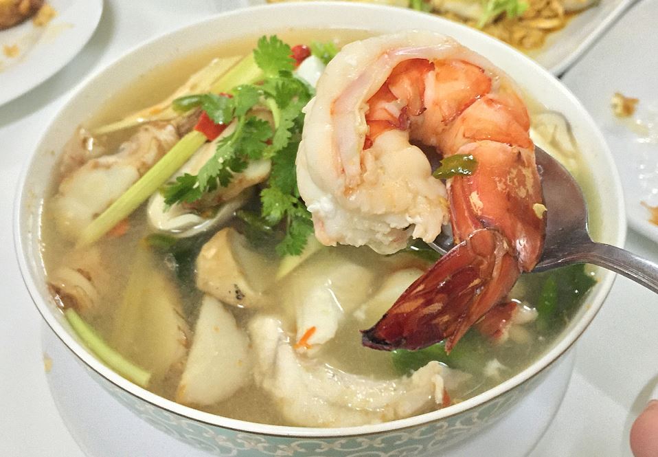 Seafood Tom Yum Talay with lemon leaves at Raan Jay Fai.