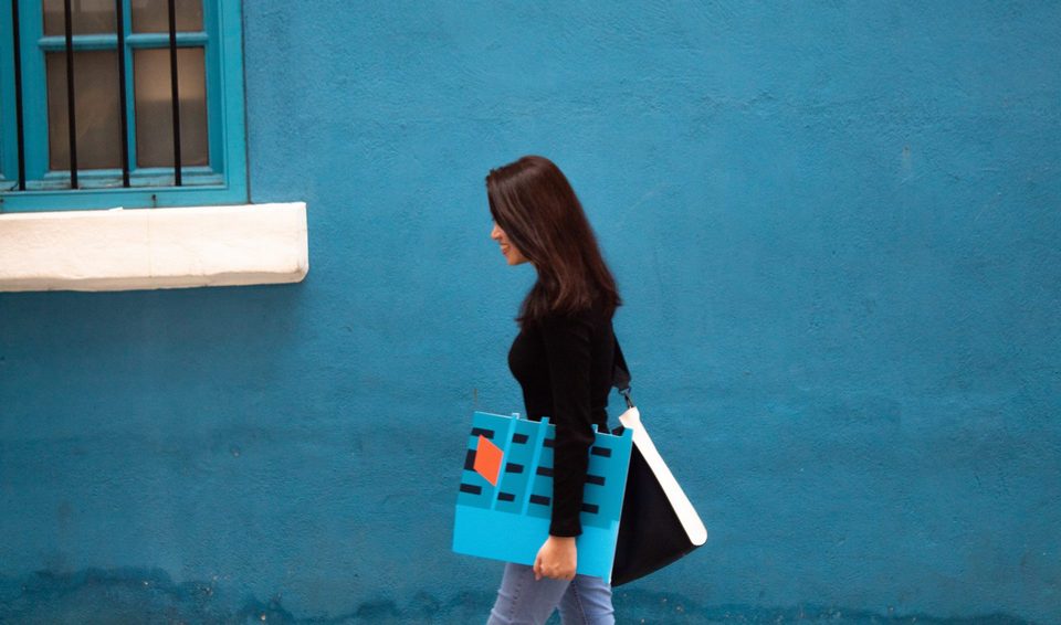 Laura-Laviani-walking-in-for-of-the-bluehouse-in-Wan-Chai
