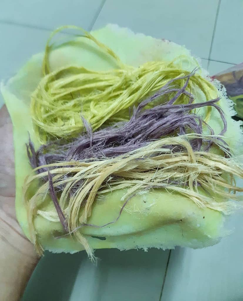 Roti Sai Mai with colorful sweet filling wrapped in thin crust.