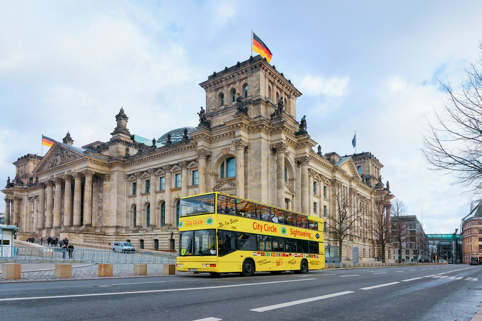 Yellow Touristic shuttle bus Reichstag building in Berlin