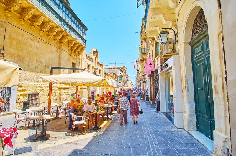 valletta-malta-june-line-cozy-outdoor-cafes-merchants-street-perfect-place-to-relax-shade-watch-passersby-144040104