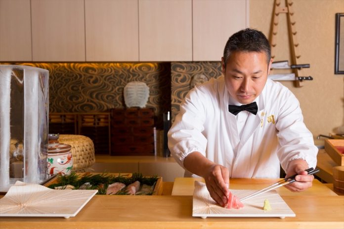 A chef at Sushi Monji restaurant, Osaka, Japan